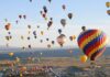 Balon ve Hava Sporları Festivalleri Rüzgâr Gibi Geliyor Balon ve hava sporları festivalleri, doğanın güzelliğiyle adrenalin tutkusunu bir araya getirerek ziyaretçilerine unutulmaz anlar yaşatıyor. Türkiye başta olmak üzere dünyanın birçok ülkesinde düzenlenen bu festivaller, hem yerli hem de yabancı turistlerin ilgisini çekiyor. Gökyüzüne yükselen renkli balonlar, yamaç paraşütü şovları ve çeşitli hava sporları etkinlikleri, sadece sporseverleri değil, doğa ve kültür meraklılarını da kendine çekiyor. Konulu bir haber görseli.